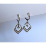 A pair of 18ct white gold diamond drop earrings set with round brilliant cut diamonds