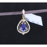 Gemporia - An 18ct gold Tanzanite and diamond Tomas Rae pendant, with a pear cut 1.