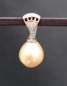 Gemporia - An 18ct gold Golden South Sea cultured pearl and diamond pendant,