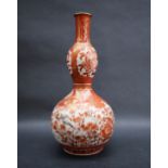 A Japanese kutani double gourd vase decorated with dragons,