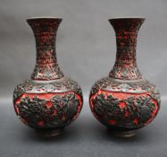 A pair of Japanese two tone lacquer baluster vases decorated with chrysanthemums and other flowers,