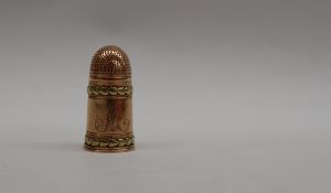 A two tone yellow metal thimble with applied leaf decoration, initialled "M" possibly George III,