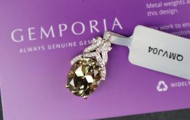 Gemporia - An 18ct gold Csarite and diamond pendant, the oval 5.