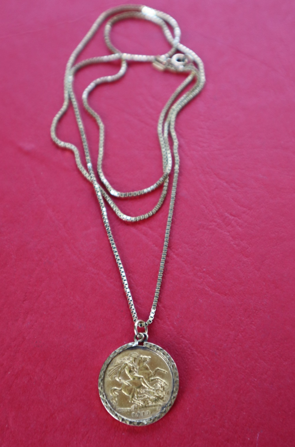 A George V gold half sovereign, dated 1911 in a 9ct gold mount on a 9ct gold chain, - Image 2 of 3