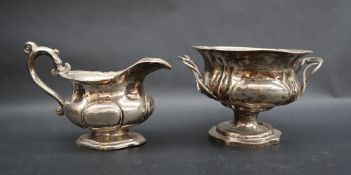 A Russian silver twin handled sugar basin of lobed form on a pedestal foot together with a similar