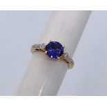 Gemporia - An 18ct gold Tanzanite and diamond Tomas Rae ring, with a round 1.