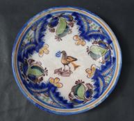 A 19th century tin glazed earthenware bowl,