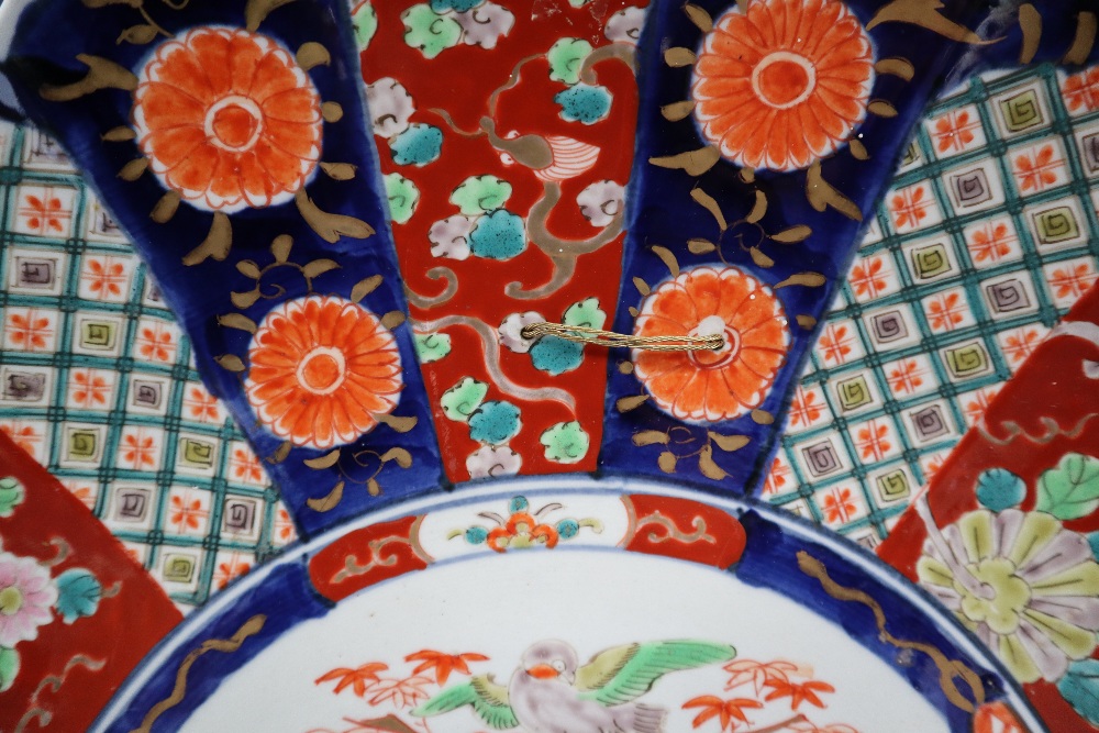 A large Japanese Imari charger decorated with radiating panels of flowers and geometric decoration, - Image 3 of 3