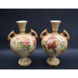 A pair of Royal Worcester porcelain twin handled vases transfer and infill decorated with flowers