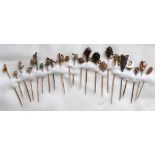 An 18ct yellow gold seed pearl set stick pin together with an 18ct gold chick mounted stick pin,