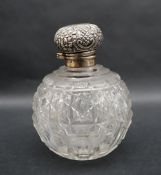 An Edward VII silver topped and cut glass scent bottle of globe form, Birmingham, 1904,