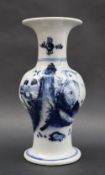 A K'ang Hsi period, Ching Dynasty baluster vase painted with a mountainous landscape scene,