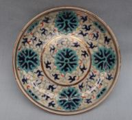 A Chinese porcelain saucer dish, with enamel decoration of flowers and scrolls,