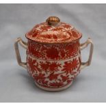 A Chinese porcelain twin handled vase and cover decorated with gilt highlighted iron red flowers,