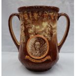 A Royal Doulton twin handled loving cup in commemoration of the Coronation of Queen Elizabeth II at