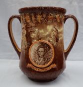 A Royal Doulton twin handled loving cup in commemoration of the Coronation of Queen Elizabeth II at