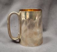 A Victorian silver tankard, of tapering cylindrical form with a gilt interior, London, 1872,