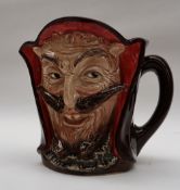 A Royal Doulton character jug of Mephistopheles, 14.