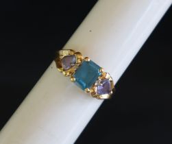 An 18ct gold dress ring set with semi precious stones, size T, approximately 4.
