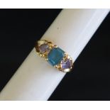 An 18ct gold dress ring set with semi precious stones, size T, approximately 4.