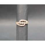 Gemporia - An 18ct gold diamond set ring, of crossover form, totalling 0.