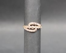 Gemporia - An 18ct gold diamond set ring, of crossover form, totalling 0.