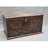 An 18th century oak deed box of rectangular form with a rectangular hinged top above a carved front,