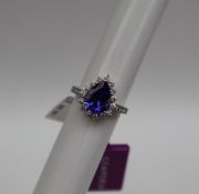 Gemporia - A 14ct gold Tanzanite and diamond white gold ring, with an pear 2.