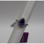 Gemporia - A 14ct gold Tanzanite and diamond white gold ring, with an pear 2.