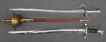 A bayonet with a fullered blade and line decorated grip,