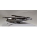 A chrome plated car mascot in the form of an eagle in flight,