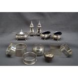 A George V silver five piece cruet set, comprising a mustard pot,