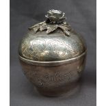 A continental white metal box and cover with floral applied finial,