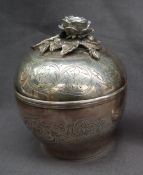 A continental white metal box and cover with floral applied finial,