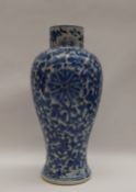 A Chinese porcelain inverted baluster vase with painted with scrolling flowers and leaves,