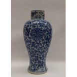 A Chinese porcelain inverted baluster vase with painted with scrolling flowers and leaves,