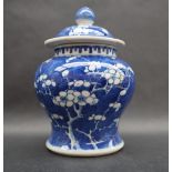 A Chinese porcelain baluster vase and cover decorated in the prunus blossom pattern,