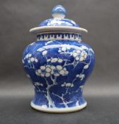 A Chinese porcelain baluster vase and cover decorated in the prunus blossom pattern,