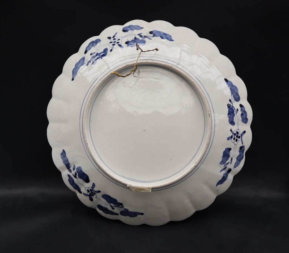 A large Japanese Imari charger decorated with radiating panels of flowers and geometric decoration, - Image 2 of 3