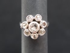 A diamond cluster ring, set with rose cut diamonds to an 18ct gold rub over setting and shank,