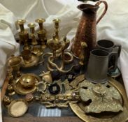 Brass candlesticks together with other brass wares, copper jug,