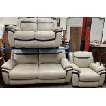 A cream and brown leather three piece suite comprising a three seater settee,