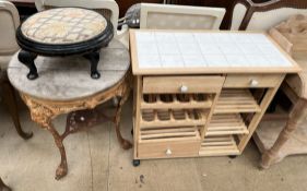 A pub table with a cast iron Britannia decorated base together with a tiled top kitchen unit and an