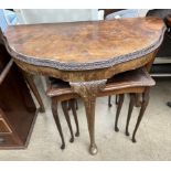 A 20th century burr walnut side table together with a nest of three tables