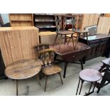 An Ercol sideboard together with a set of four Ercol dining chairs, an Ercol drop leaf dining table,
