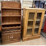 A 20th century pine waterfall bookcase and wine rack,