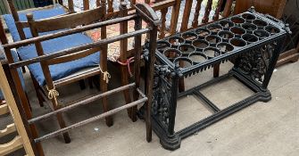 A large cast iron umbrella stand of rectangular form, with twin handles and cast ends,