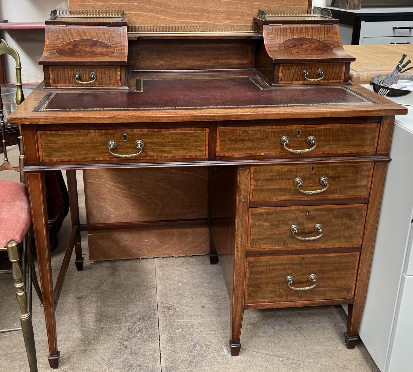 A lady's mahogany writing desk with a raised galleried superstructure,