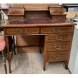 A lady's mahogany writing desk with a raised galleried superstructure,
