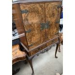 A 20th century walnut drinks cabinet,